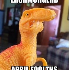 A plastic dinosaur with it's mouth stuck to look like it has a lisp. Meme text reads "ERGHMUHGERD APRIL FOOLTHS" because the Skepticon organizers think they're hilarious.
